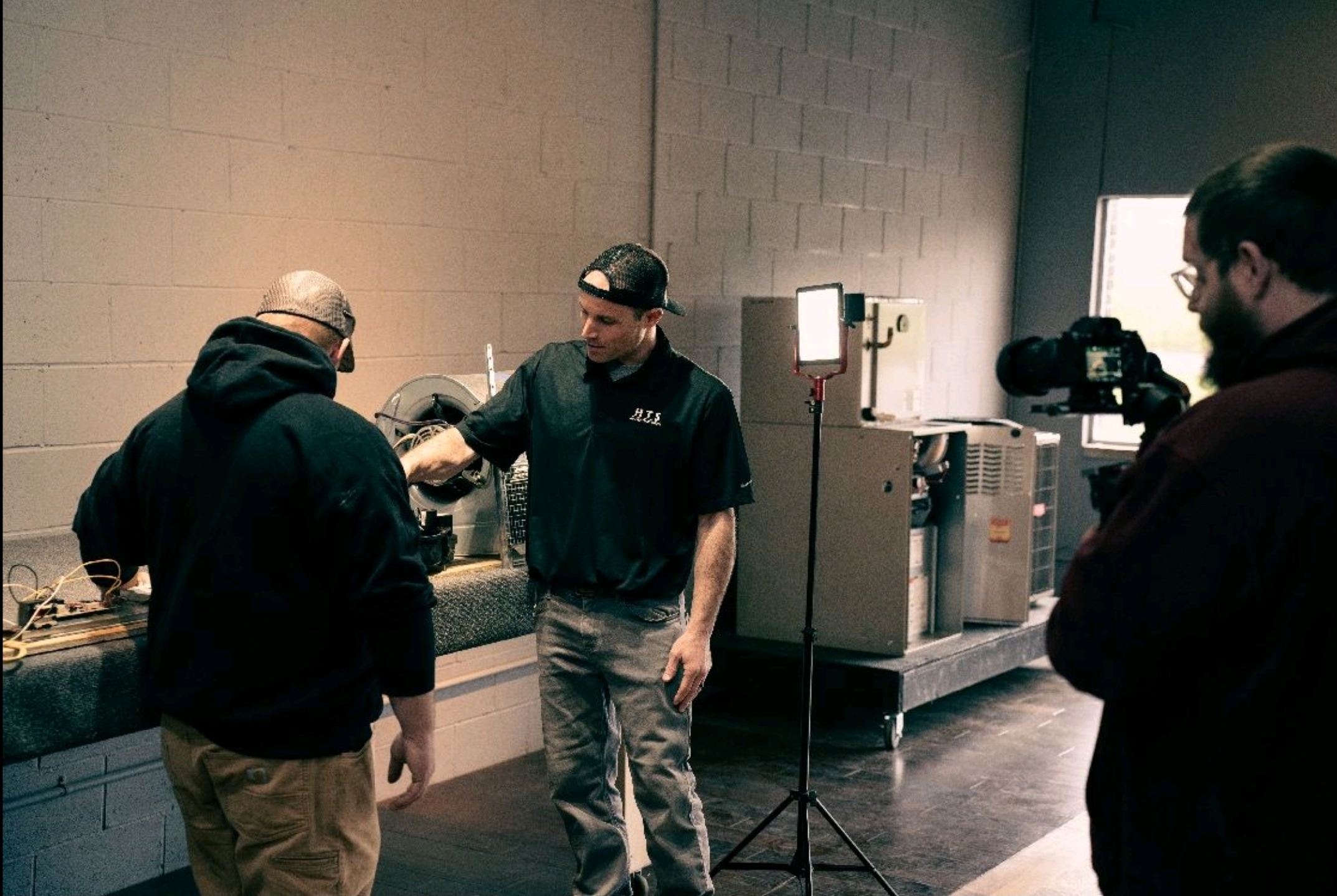 Instructor showing HVAC students equipment in Greenwood, IN